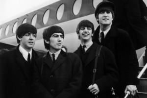 8th February 1964:  British pop phenomenon The Beatles standing on the steps of an aeroplane at London Airport. Left to right, Paul McCartney, George Harrison (1943 - 2001), Ringo Starr and John Lennon (1940 - 1980).  (Photo by Evening Standard/Getty Images)